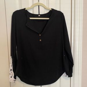 Women’s black Henley, long sleeve shirt with crocheted insert on sleeve